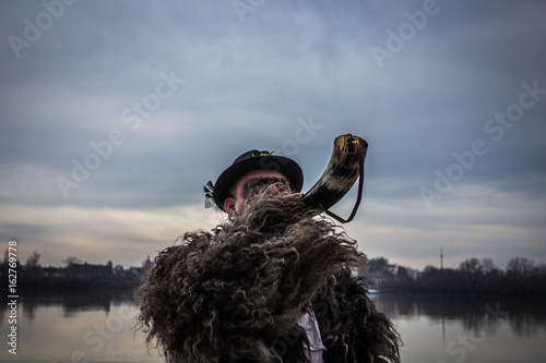 Blowing the horn signalling the crossing of the river photo