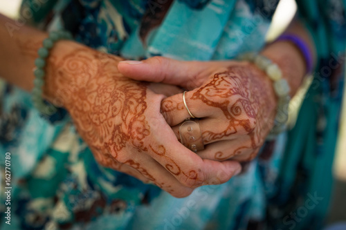 Photography Henna painted hand of a female devotee