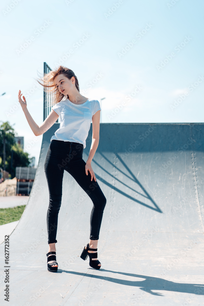 beautiful young girl posing on the playground beautiful young girl posing on the playground
