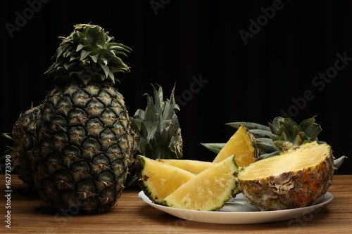 pieapple on table with black background photo