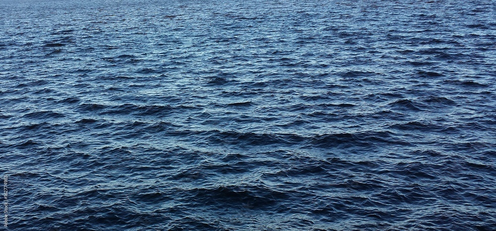 Blue water surface with soft waves on Florida river Blue water surface with soft waves on Florida river