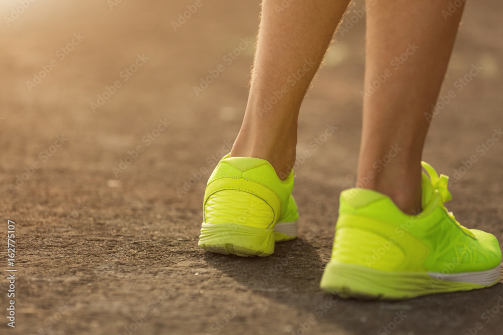 Jogging / running sneakers on the asphalt outdoors.