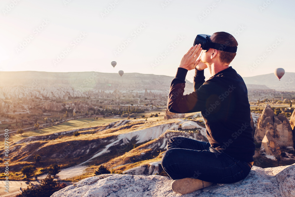 The man with glasses of virtual reality. Future technology concept. Modern imaging technology. The man with glasses of virtual reality. Future technology concept. Modern imaging technology.