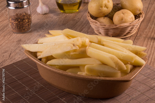 Raw Potato sliced strips prepared for French fries