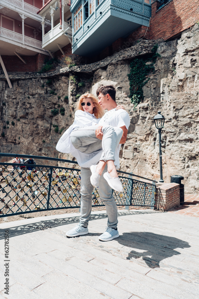 Guy with a girl standing on bridge Guy with a girl standing on bridge