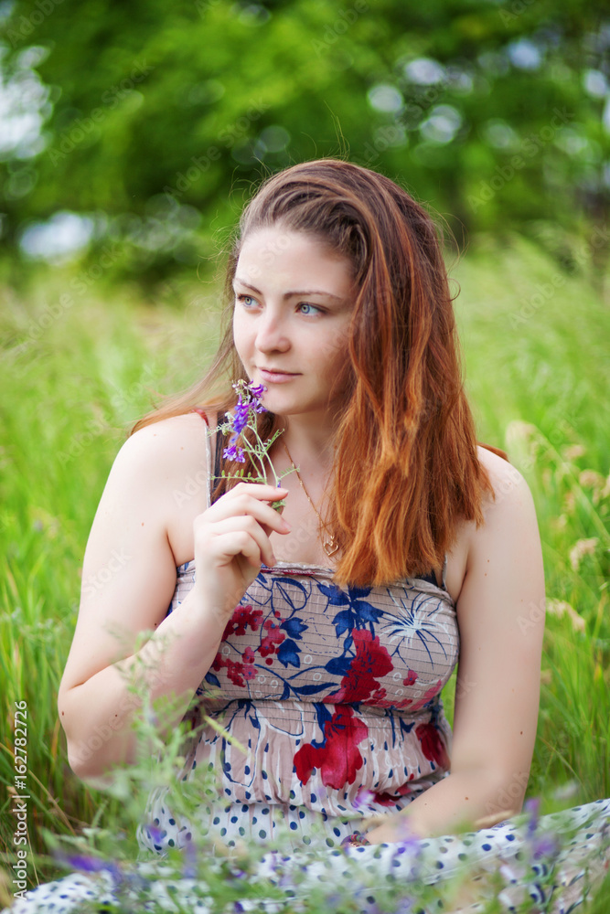 Happy beautiful young woman laughing and smiling on nature Happy beautiful young woman laughing and smiling on nature