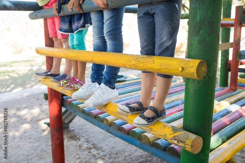 Konstfotografi Low section of children standing on jungle gym