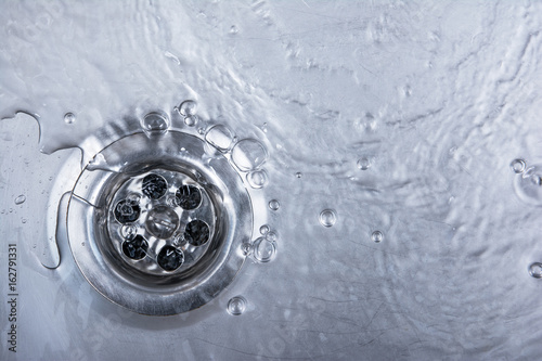 sink, drain and flowing water for background