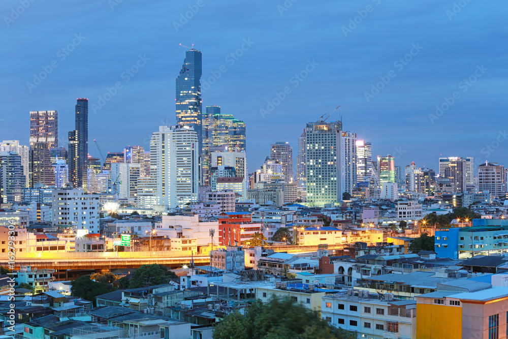 View of Bangkok at twilight time in cityscape.