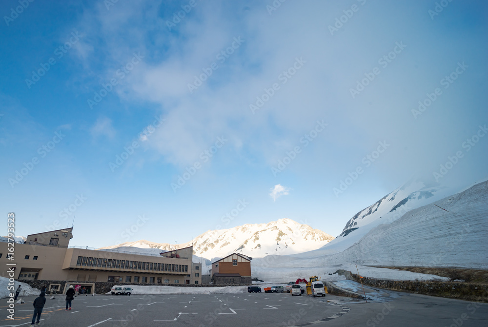 Tateyama, Japan - May 14, 2017 : Unknown tourist walking back to Hotel Tateyama on Tateyama Mountain, Japan. Tateyama, Japan - May 14, 2017 : Unknown tourist walking back to Hotel Tateyama on Tateyama Mountain, Japan.