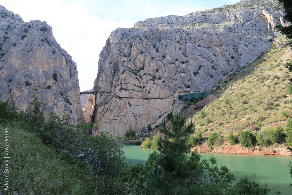 Landscape with the river Guadalorce passing under the bridge of the gorge of the Gaitanes in the Caminito del Rey, Malaga, Spain