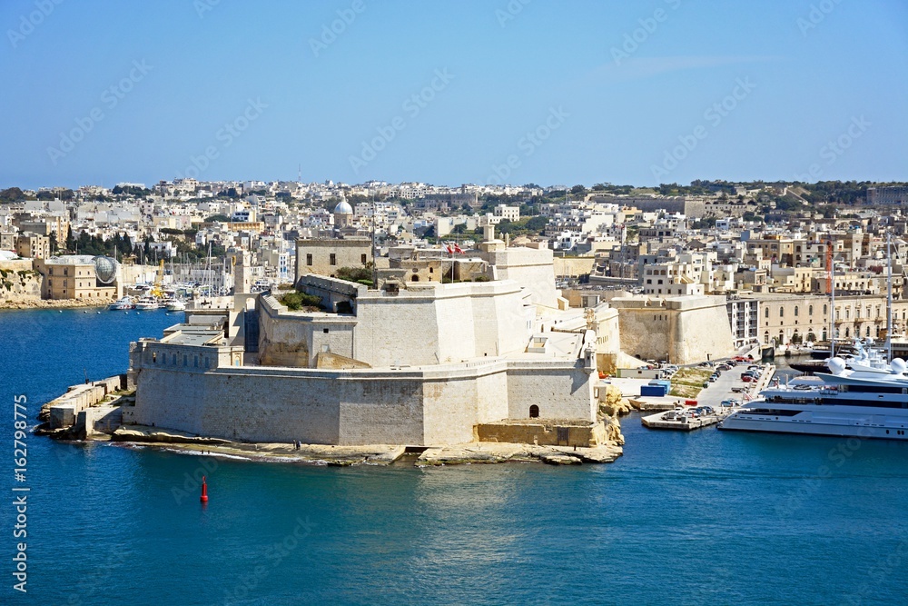 View towards Vittoriosa and Fort St Angelo seen from Valletta, Malta.