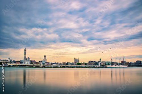 Tall Ship Antwerp. An Antwerp cityscape with the Juan Sebastián de Elcano (training ship for the Royal Spanish Navy). It is a four-masted topsail, steel-hulled barquentine . photo