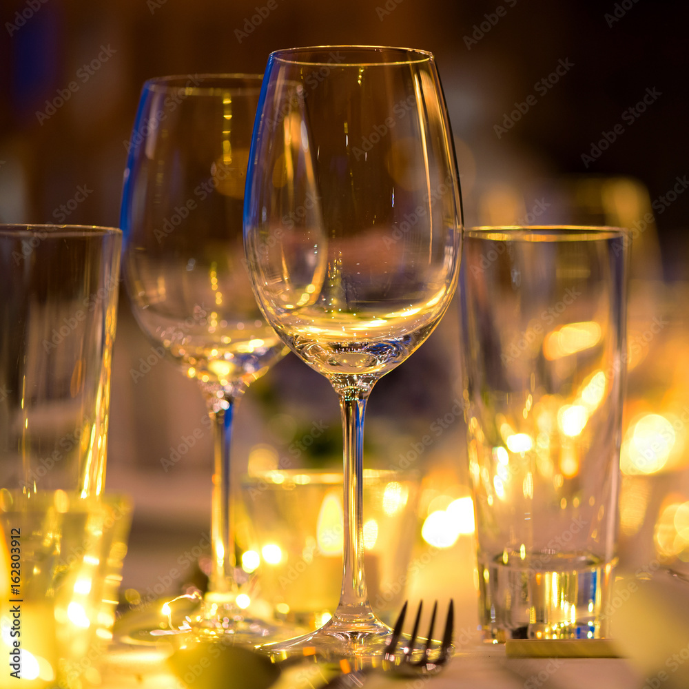 Glass of wine on the table,Romantic Dinner wedding set up.