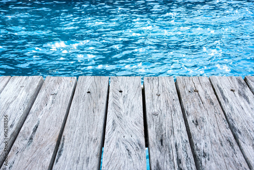 wooden terrace and sea reflections. © satit