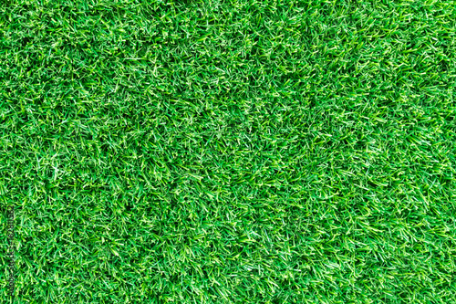 Artificial green grass texture for golf course, soccer field or sports background concept design.