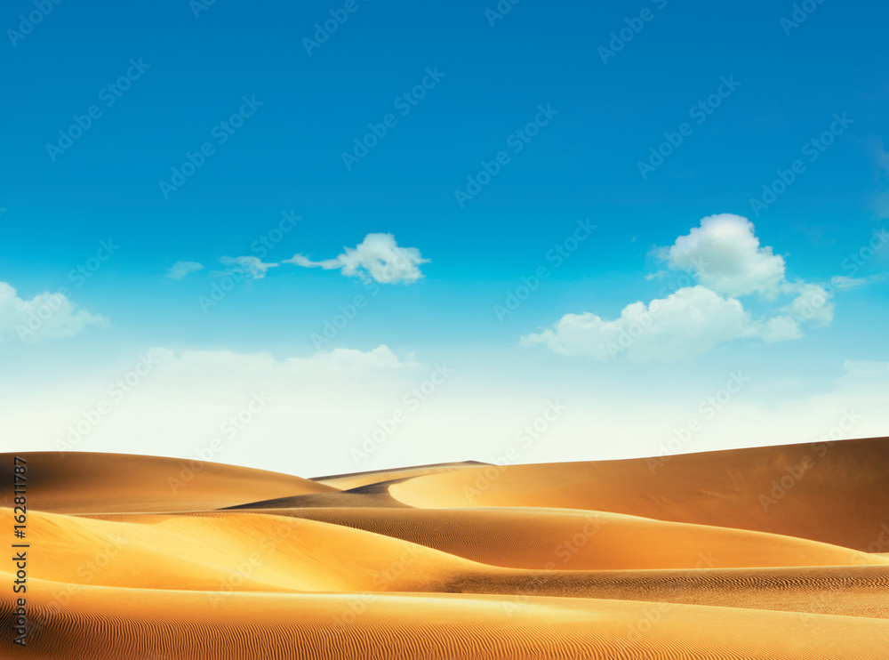 Desert and blue sky with clouds