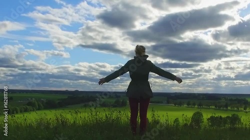 Wallpaper Mural Woman raising hands on the top of mountain, steadicam shot. Slow motion footage. Torontodigital.ca