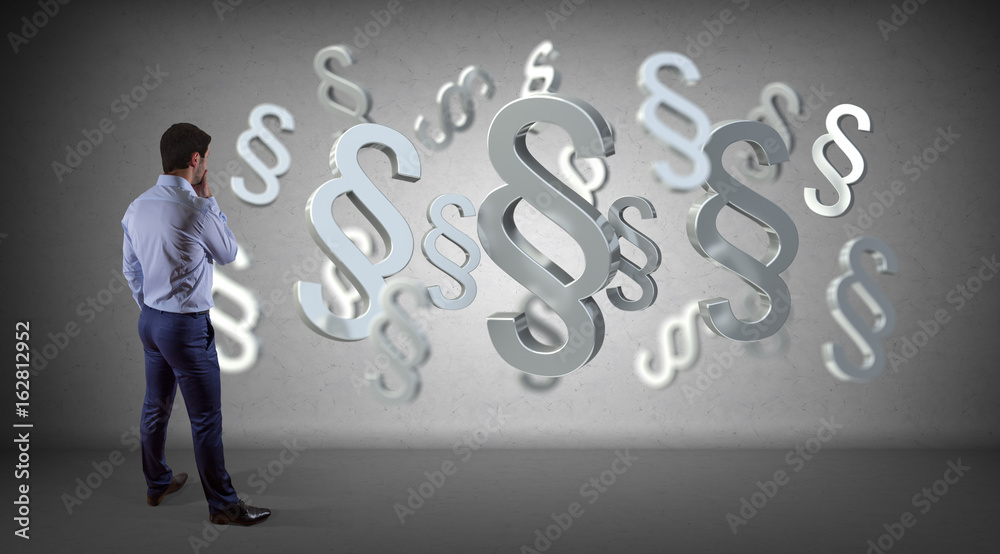 Businessman using law interface on a wall 3D rendering Businessman using law interface on a wall 3D rendering