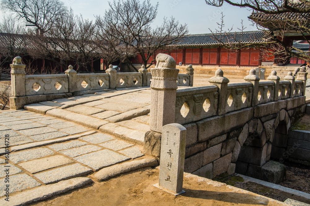 Okcheongyo Bridge which is a stone bridge built in Changgyeonggung palace. South Korea, Seoul. (Sign board text is Okcheongyo Bridge which is a stone bridge built in Changgyeonggung palace. South Korea, Seoul. (Sign board text is