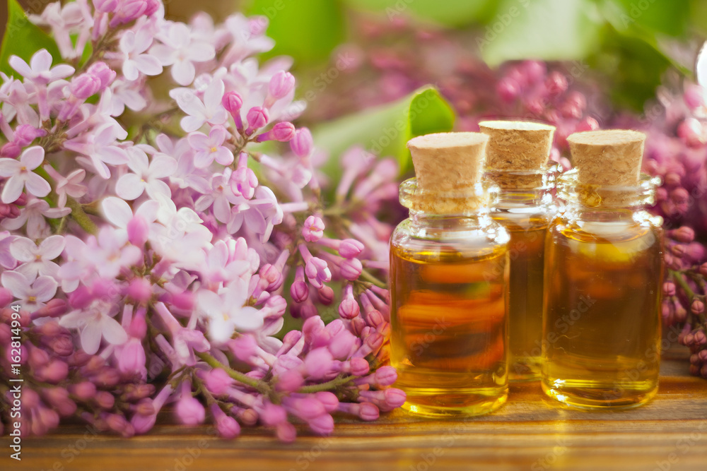 Essence of flowers on table in beautiful glass jar Essence of flowers on table in beautiful glass jar
