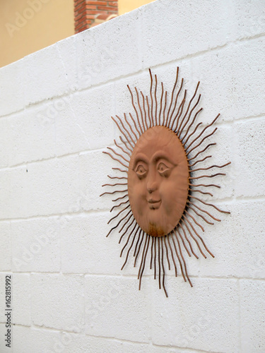 Sun on garden wall photo