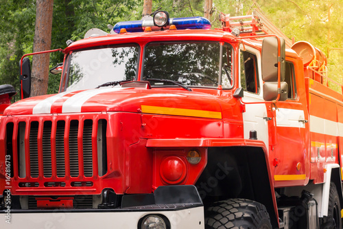 old Red Municipal Fire truck. Extinguishing fire.