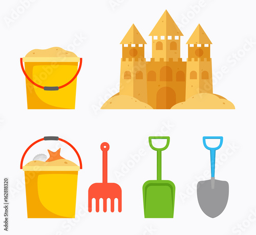 Beach sand castle with children's bucket, sand bucket, shovel, r