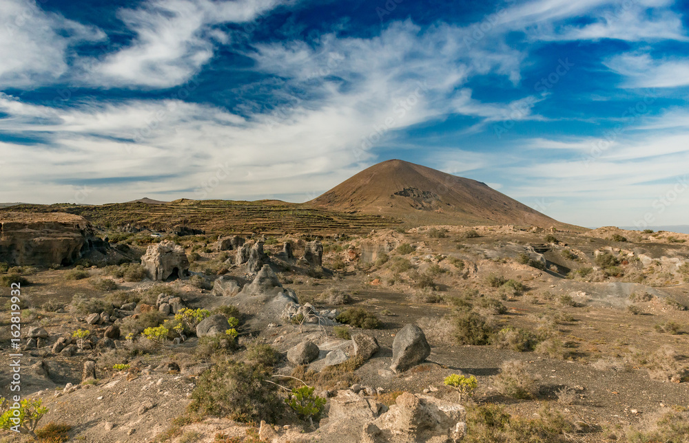 picturesque landscape of Lanzarotte desert and blue sky picturesque landscape of Lanzarotte desert and blue sky