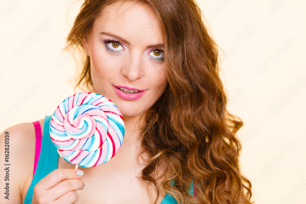 Woman joyful girl with lollipop candy