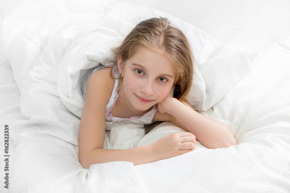 child wrapped with a white blanket, awake child wrapped with a white blanket, awake