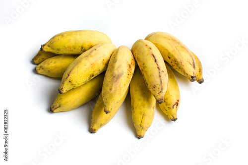 Small tropical banana cluster isolated on white