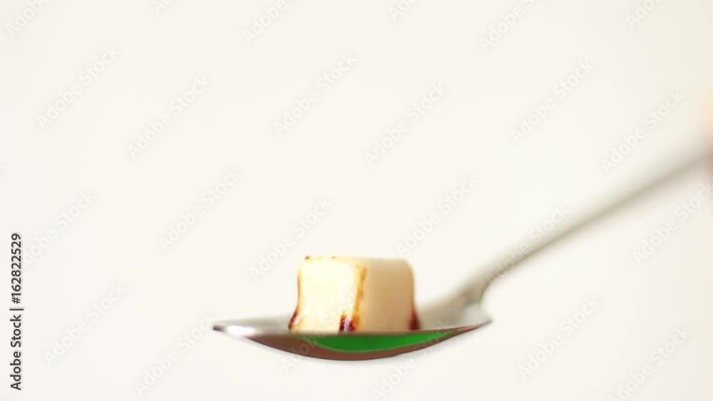 Melting sugar in the teaspoon Melting sugar in the teaspoon