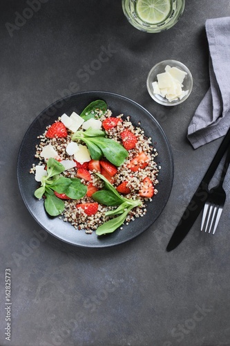  Quinoa salad with strawberry and parmesan cheese. Overhead view. Copy space