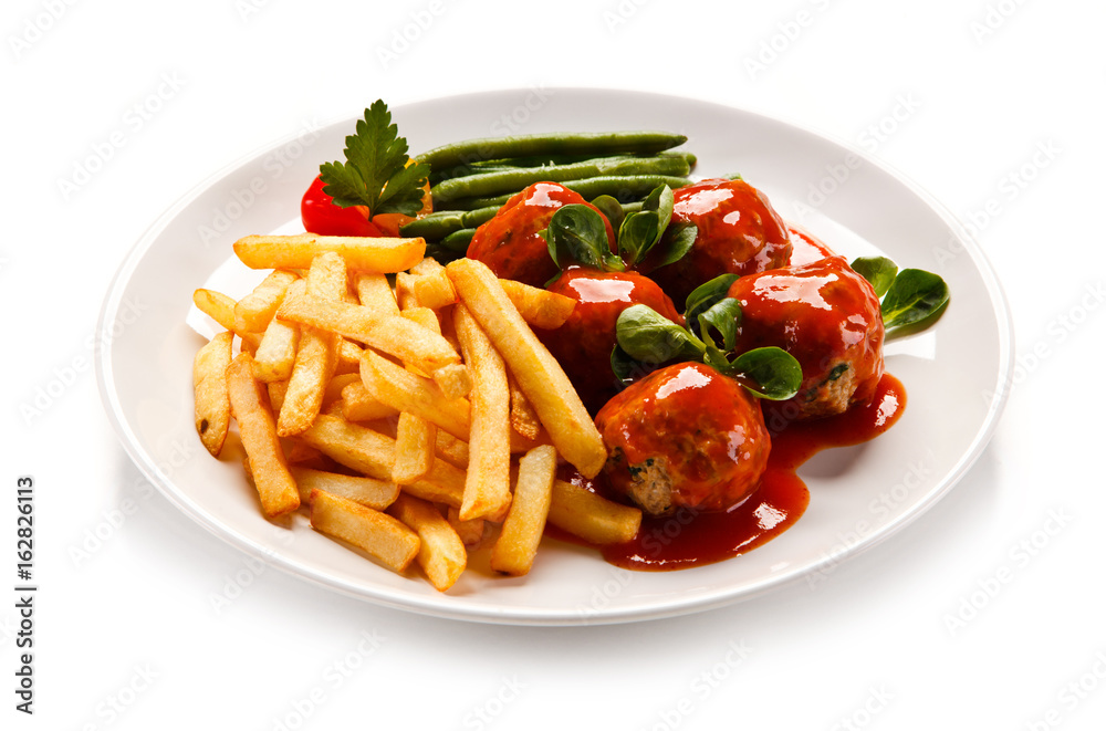 Roast meatballs, chips and vegetables Roast meatballs, chips and vegetables