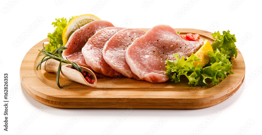 Fresh raw pork on cutting board on white background 