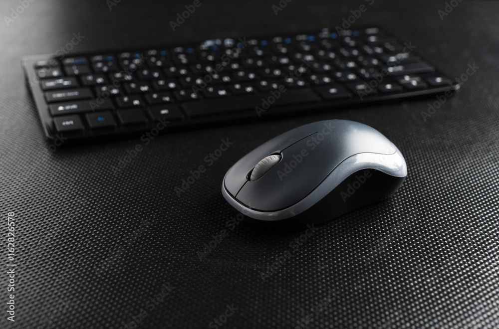 keyboard and mouse on the table . keyboard and mouse on the table .