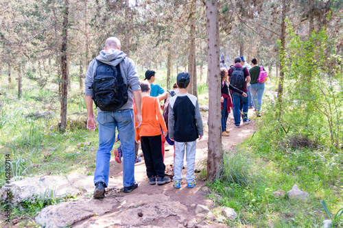 JERUSALEM - FEB. 11, 2017: Group of Isaraeli fourth grade school kids and their parents on a field trip in a forest near Jerulaem