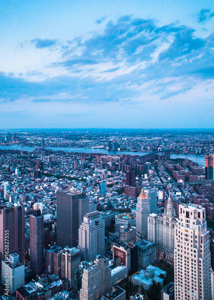 Aerial view of downtown Manhattan and Financial District at dusk. 