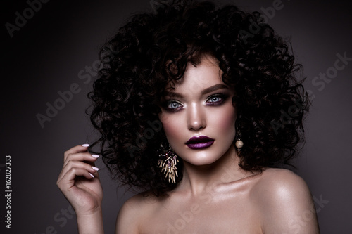 Canvas Print Beauty young woman with curly small and long hair
