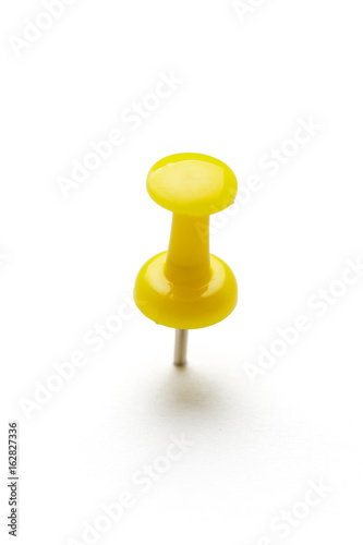 close up of a pushpin on white background