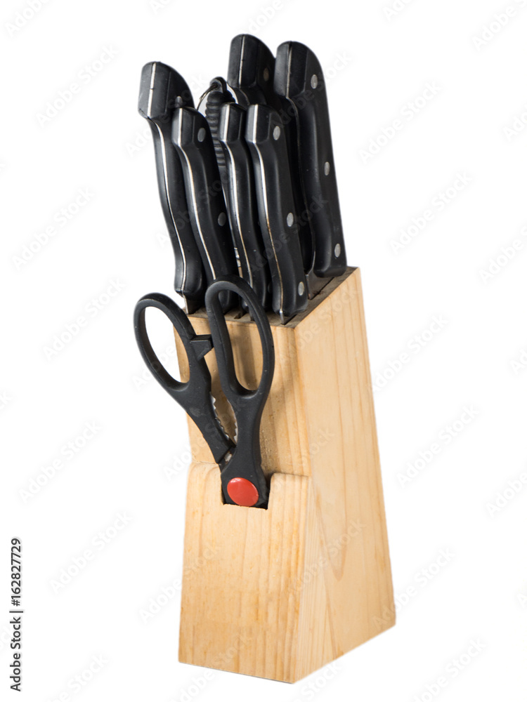 Kitchen knifes set with wooden stand over white background Kitchen knifes set with wooden stand over white background