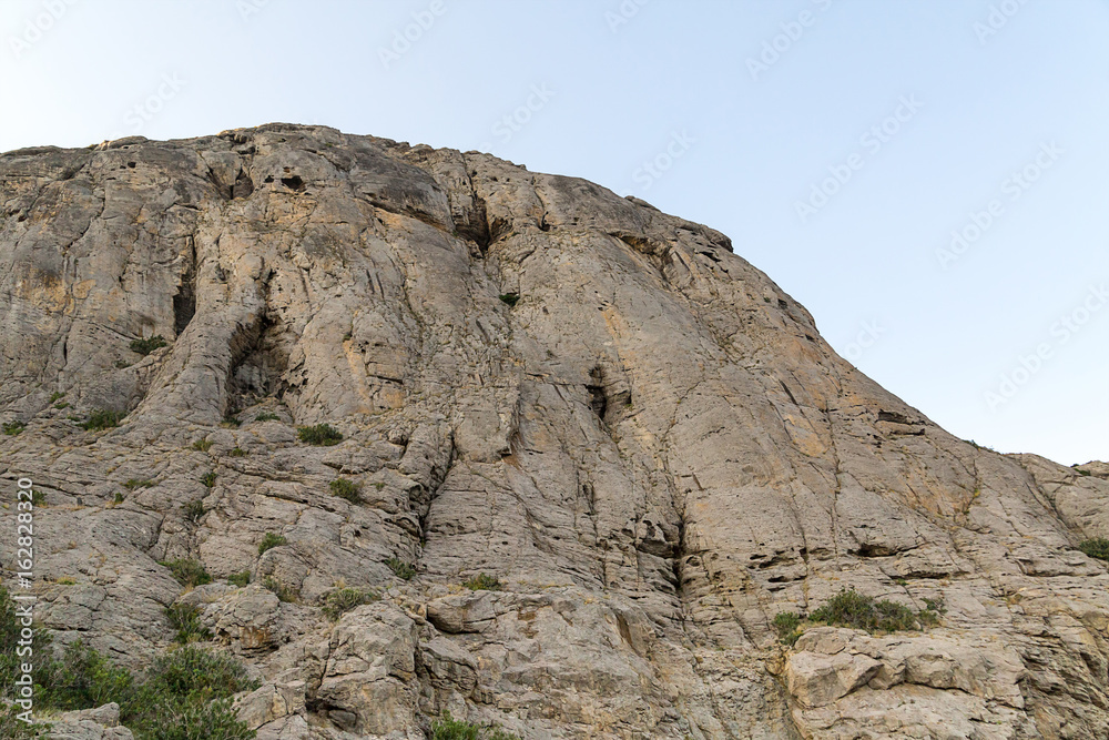 High mountain with smooth walls and uneven top unapproachable majestic High mountain with smooth walls and uneven top unapproachable majestic