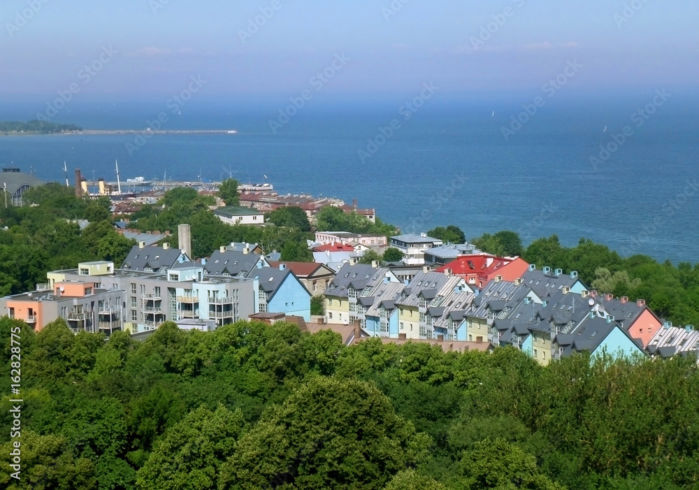 Pastel color buildings amongst green space on the shore of Baltic Sea, Tallinn, Estonia