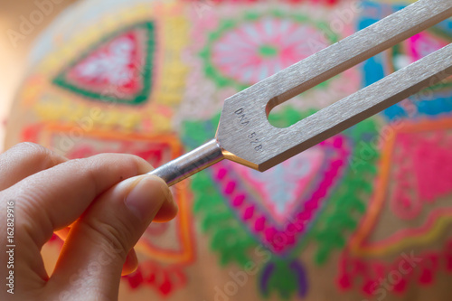 tuning fork and crystal on table .