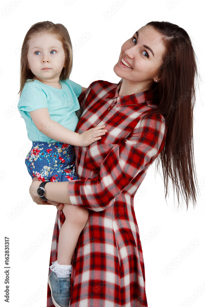 The mother embracing her little daughter against white background. Isolated The mother embracing her little daughter against white background. Isolated