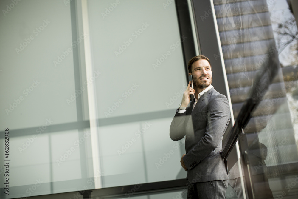 Young successful men entrepreneur using mobile phone outdoor Young successful men entrepreneur using mobile phone outdoor