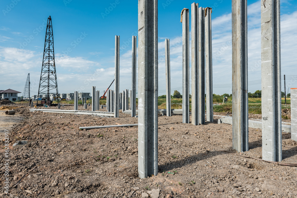 consruction site with  precast concret pile and pile-driver