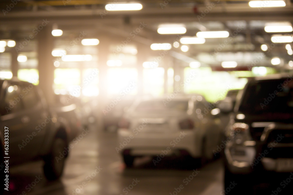 Blur image in parking area under building. Blur image in parking area under building.