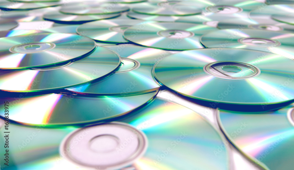C cd y y. Фон CD дисков. Куча CD-ROM. DVD фон. Пленка от диска фон.